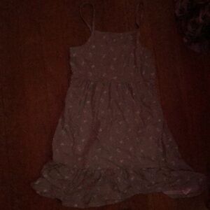 It’s a gray and white dress, it has white flowers and the rest is gray
